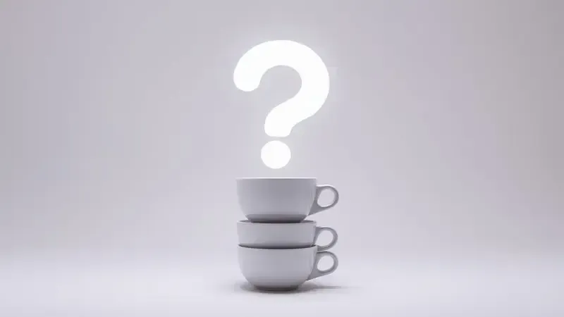 Ícone conceitual de perguntas frequentes com ponto de interrogação sobre xícaras de café.